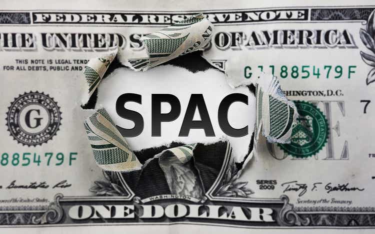SPAC - Special Purpose Acquisition Company -- text on a torn dollar bill