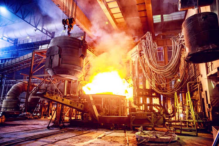 Scrap metal being poured into an Electric Arc Furnace at a Steel Factory