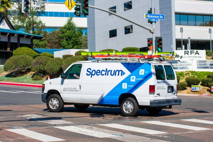 Charter Spectrum Phone, Cable TV, and Internet telecommunications service van is driving to performing a service call - San Diego, California, USA - 2020
